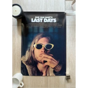 Official movie poster for Gus Van Sant's Last Days featuring actor Michael Pitt wearing iconic white oval sunglasses over a dark moody blue backdrop.