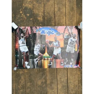Vintage Starline official NBA poster titled The Magic Show featuring Shaquille O'Neal, Penny Hardaway, Nick Anderson, and Horace Grant in white Orlando Magic uniforms against an Orlando city skyline.