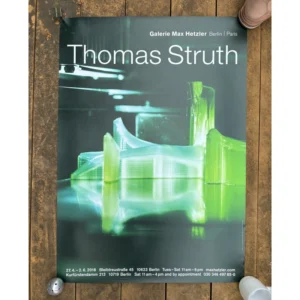 Exhibition poster for Thomas Struth at Galerie Max Hetzler featuring a luminous green semi-transparent 3D printed architectural structure with reflections on a dark glossy surface.