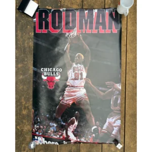 Vintage Starline official NBA poster for Dennis Rodman 1996 featuring him in a white Chicago Bulls No. 91 jersey grabbing a rebound with bold RODMAN text across the top.