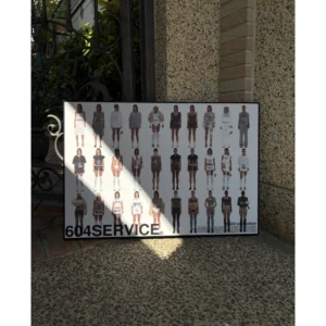 Official 604SERVICE 0524 collection poster featuring a grid layout of model lookbook shots, framed in a slim black wooden frame, measuring 51.5x72.5cm.