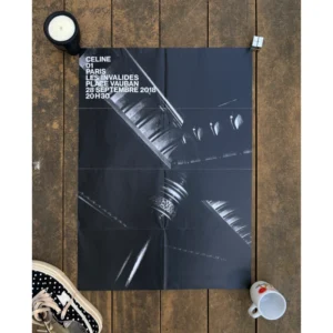 Official double-sided CELINE SS19 show invitation art poster by Hedi Slimane, featuring a dramatic monochromatic photo of a Parisian spiral staircase on one side, and a twinkling rhinestone fishnet pattern on the reverse, with white show text, measuring 72x56.5cm.