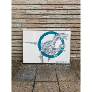 Framed official Hajime Sorayama artwork poster featuring metallic Mechanical Raptor dinosaurs leaping through a teal geometric circle in a sleek aluminum frame.