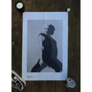 Official double-sided TOGA S/S 2023 fashion poster shot by Camille Vivier, featuring black-and-white high-fashion portraits of a bald model in avant-garde poses and striped bodywear, measuring 80.5x53cm.